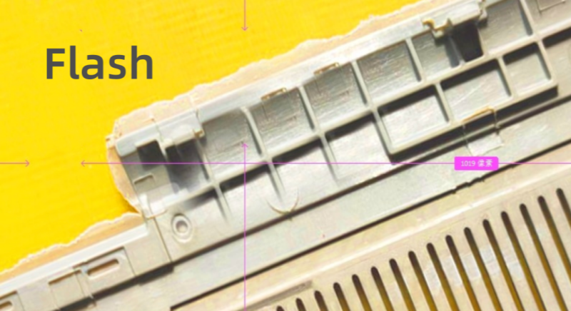 PEEK injection molding flash example